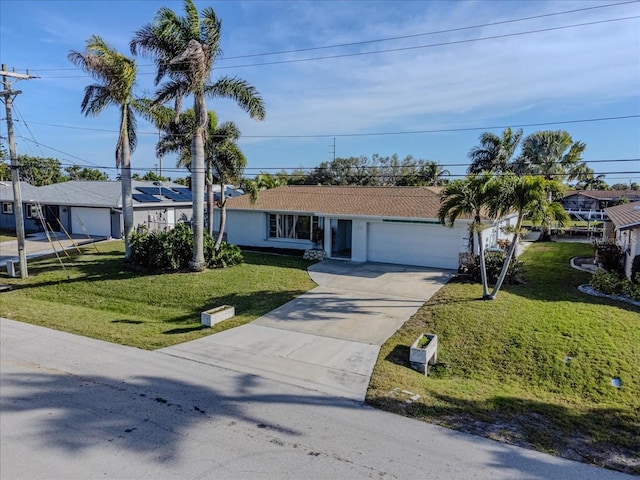 single story home featuring a front yard and a garage