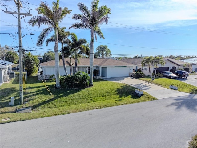 ranch-style home with a front yard and a garage