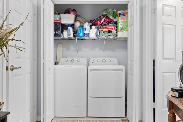 washroom with washing machine and dryer