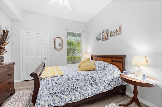 bedroom featuring light hardwood / wood-style floors and ceiling fan