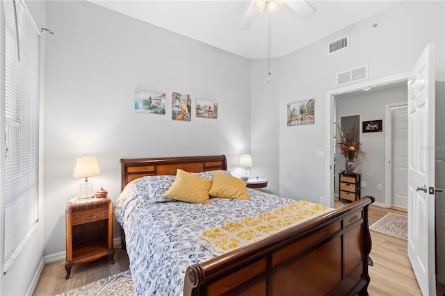 bedroom with ceiling fan and light wood-type flooring