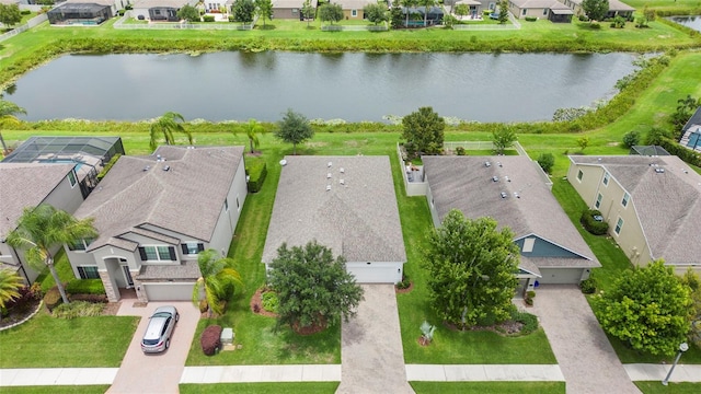 birds eye view of property with a water view