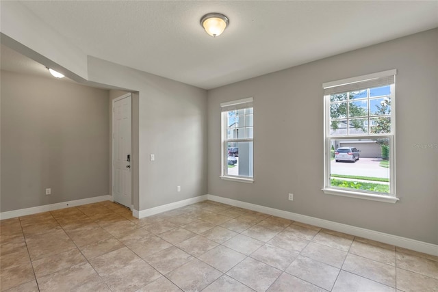 tiled empty room with plenty of natural light