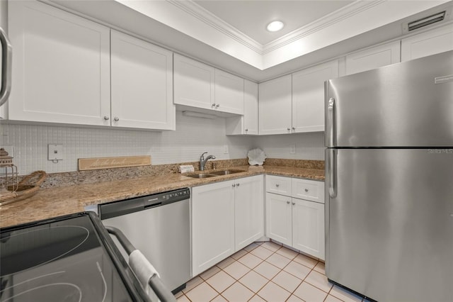 kitchen featuring white cabinetry, stainless steel appliances, light tile patterned flooring, ornamental molding, and sink