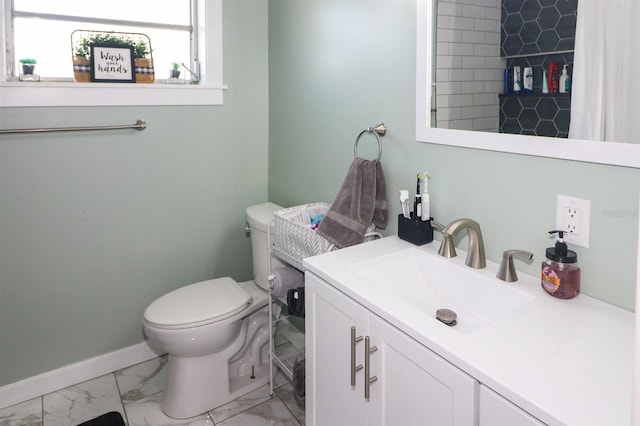 bathroom featuring tile flooring, large vanity, and toilet