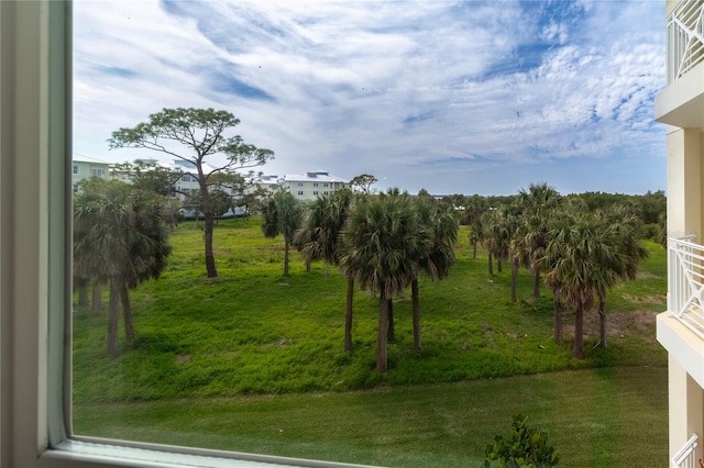 view of yard featuring a balcony