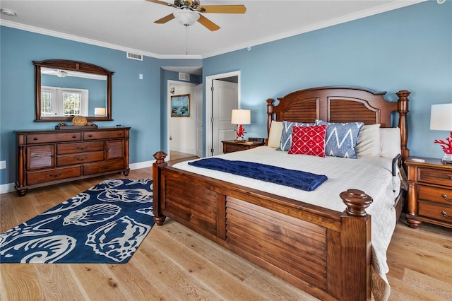 bedroom with ceiling fan, ornamental molding, and light hardwood / wood-style flooring