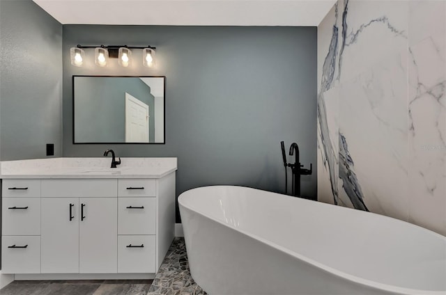 bathroom with vanity and a bathtub