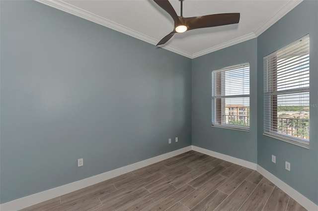 empty room featuring ornamental molding, ceiling fan, and dark hardwood / wood-style floors