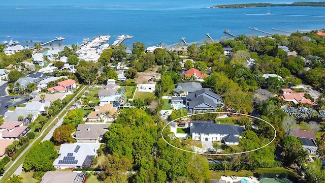 birds eye view of property with a water view