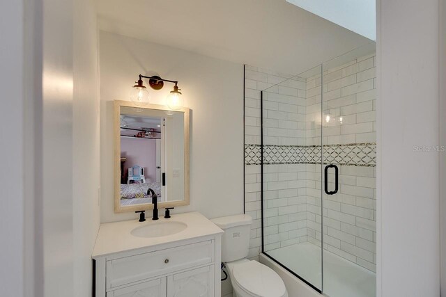 bathroom with toilet and vanity