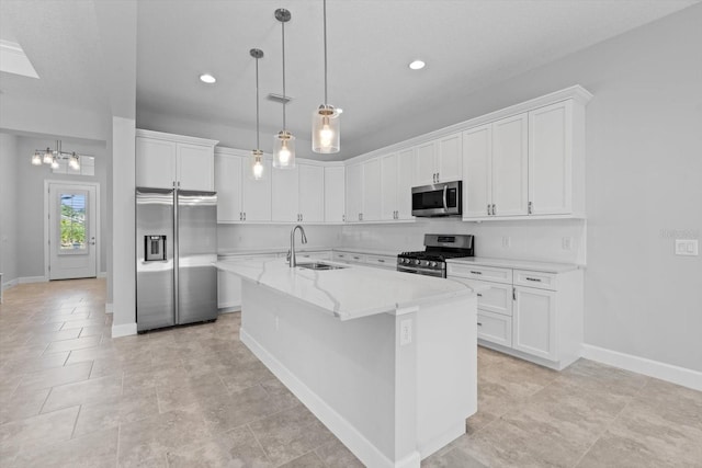 kitchen featuring a center island with sink, white cabinets, sink, and appliances with stainless steel finishes