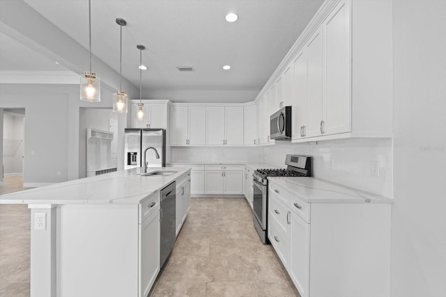 kitchen featuring white cabinetry, sink, a kitchen island with sink, and appliances with stainless steel finishes