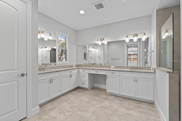 bathroom featuring vanity and walk in shower