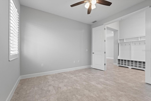 unfurnished bedroom with ceiling fan and a closet