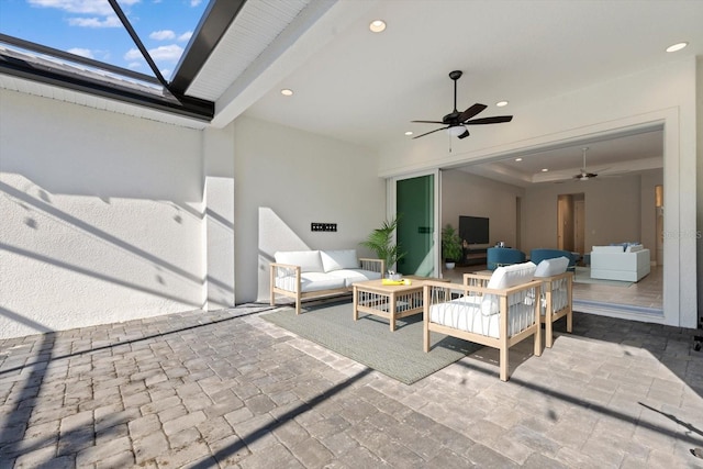 view of patio with outdoor lounge area and ceiling fan