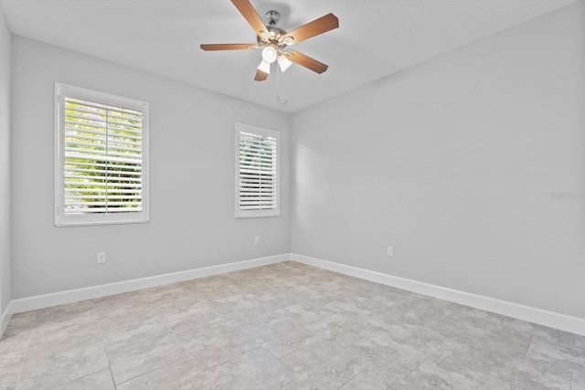 spare room featuring ceiling fan