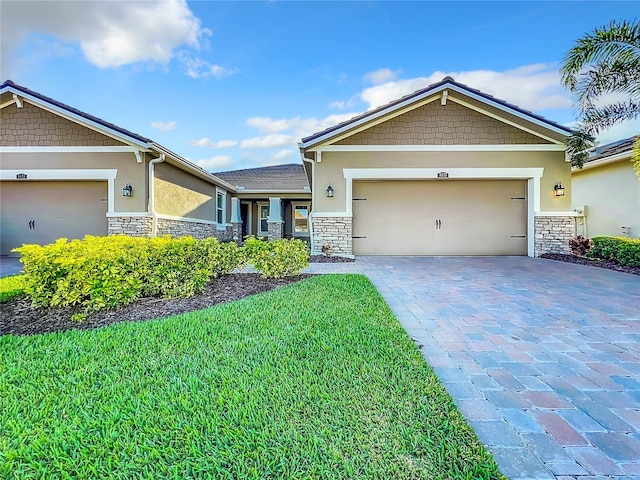 craftsman-style house with a front yard and a garage