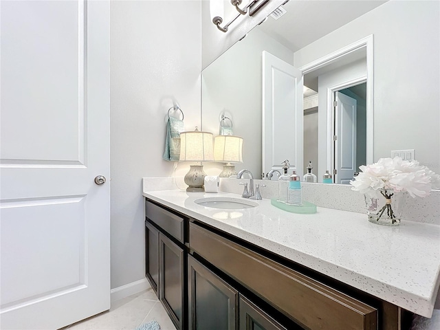 bathroom featuring tile patterned floors and vanity