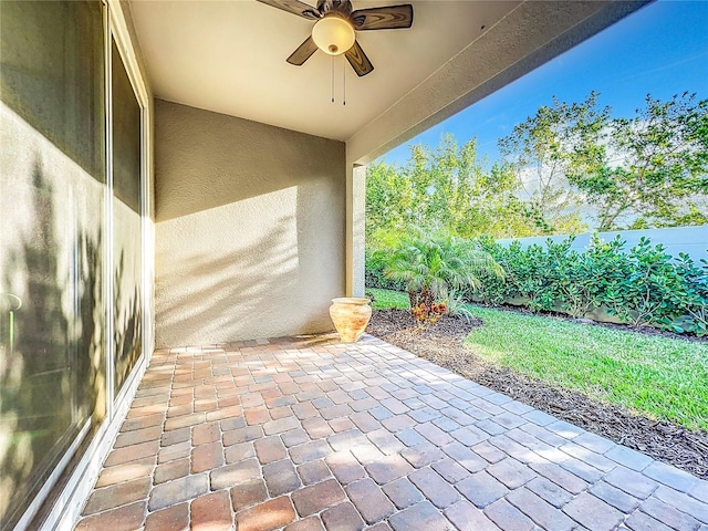 view of patio featuring ceiling fan