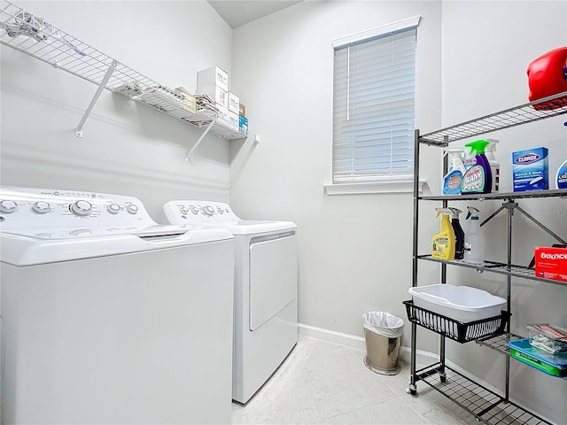 clothes washing area featuring washer and dryer