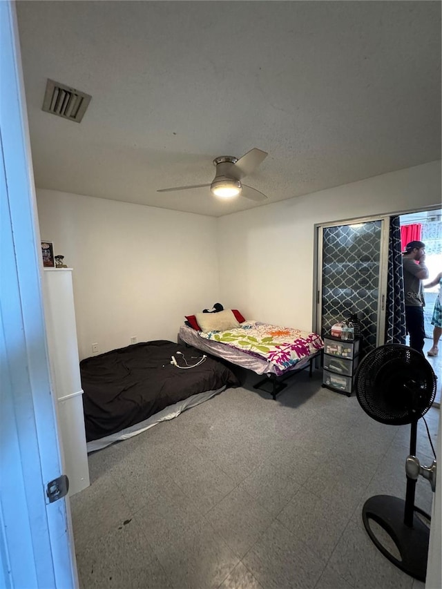 bedroom featuring tile flooring and ceiling fan