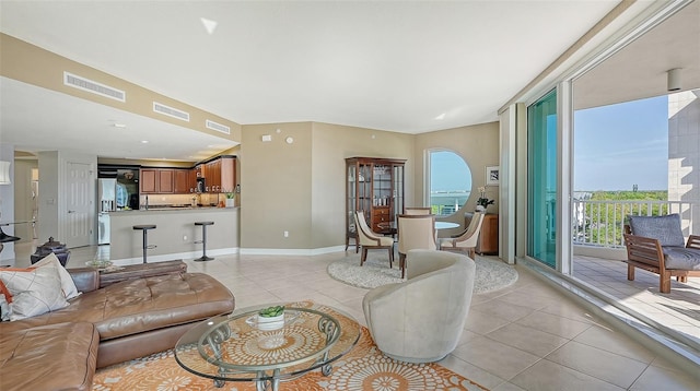 living room featuring light tile floors