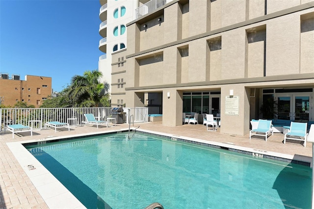 view of pool featuring a patio