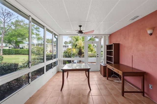 sunroom / solarium with ceiling fan and plenty of natural light