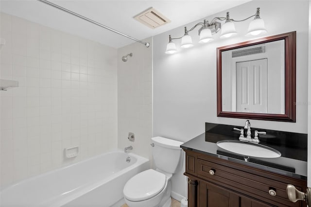 full bathroom with vanity, toilet, and tiled shower / bath