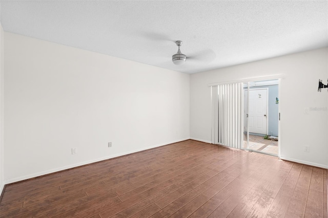 empty room featuring hardwood / wood-style floors and ceiling fan