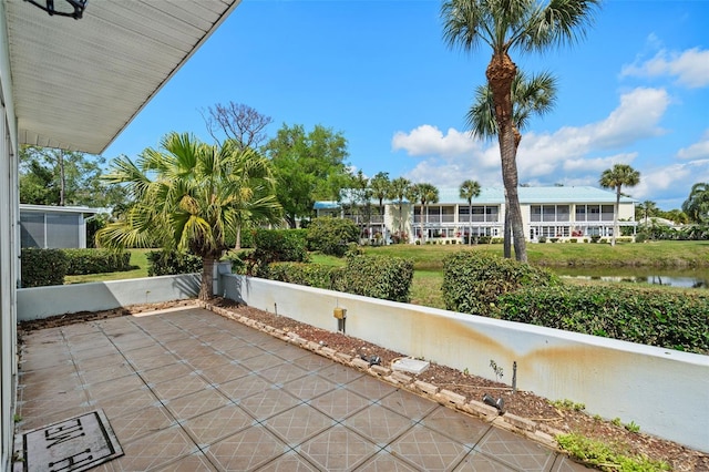 view of patio with a water view