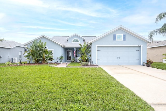 ranch-style home featuring a front yard, a garage, and ac unit