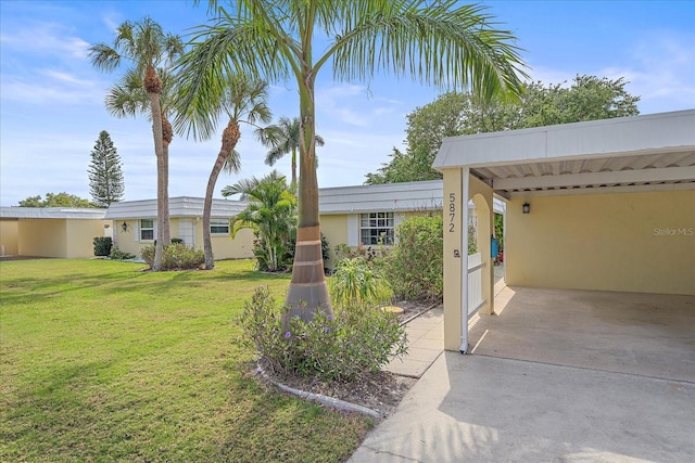 view of yard with a carport