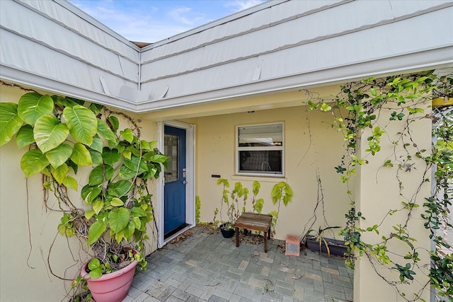 entrance to property featuring a patio area