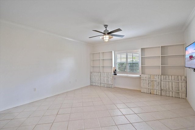 tiled spare room with crown molding, ceiling fan, and built in shelves