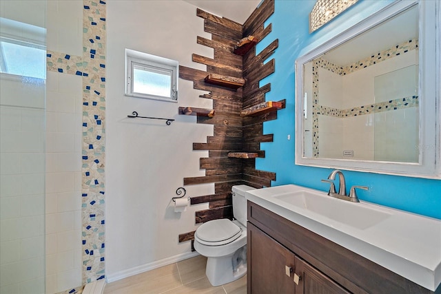 bathroom featuring tile flooring, oversized vanity, and toilet