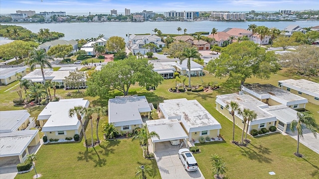 birds eye view of property with a water view