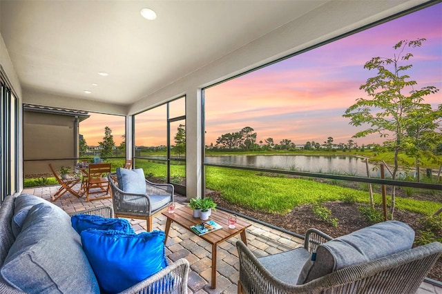 sunroom with a water view