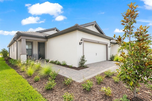 view of property exterior with a garage