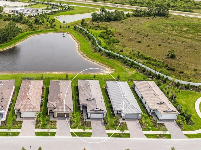 birds eye view of property featuring a water view