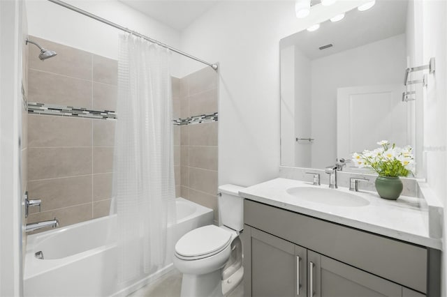 full bathroom featuring shower / bath combination with curtain, large vanity, and toilet