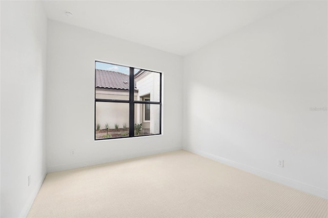 empty room with light colored carpet