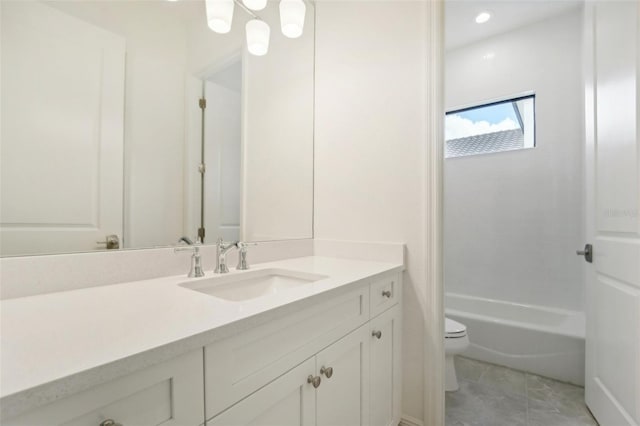 bathroom featuring vanity and toilet