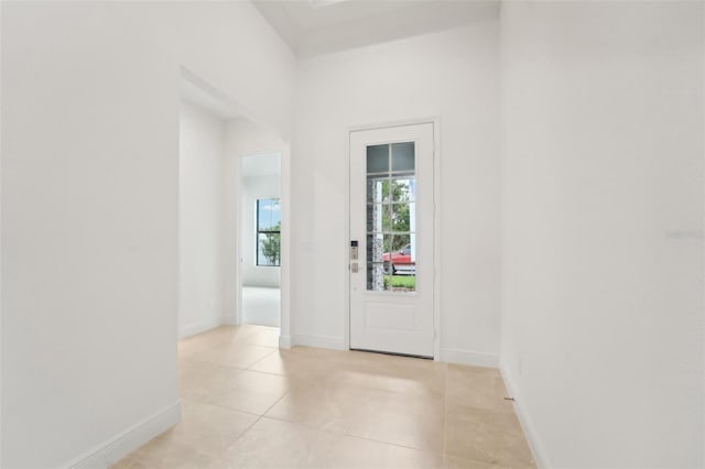 doorway featuring light tile patterned flooring