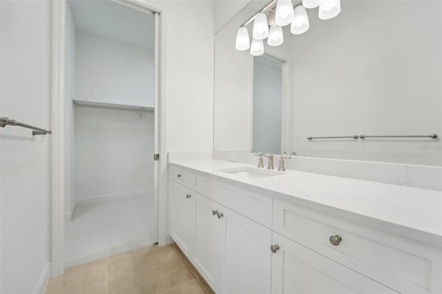 bathroom featuring tile patterned flooring and vanity