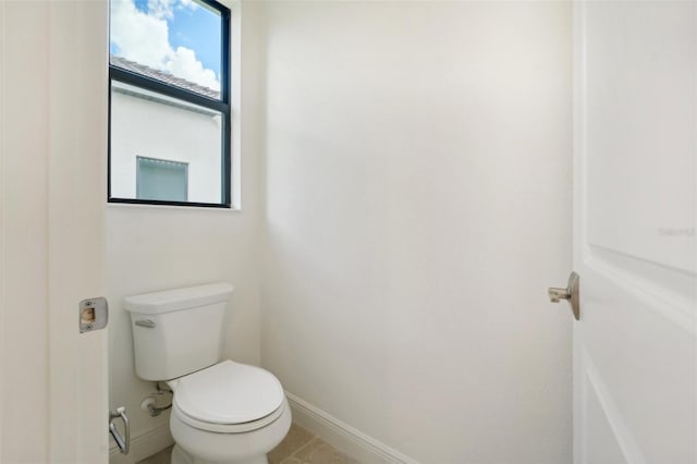 bathroom with tile patterned floors and toilet