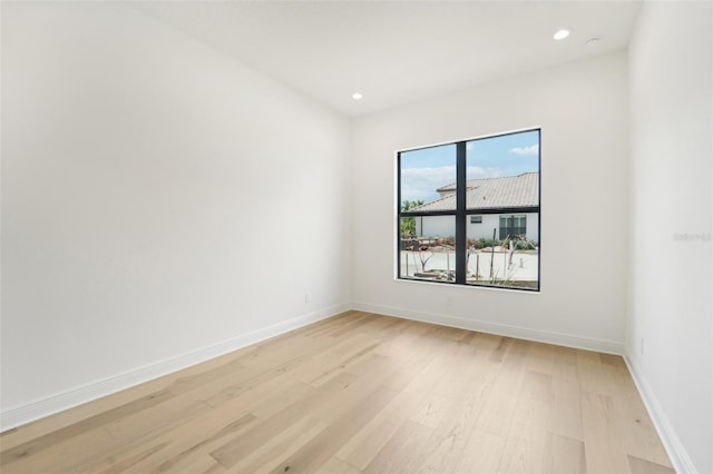 spare room with light hardwood / wood-style flooring