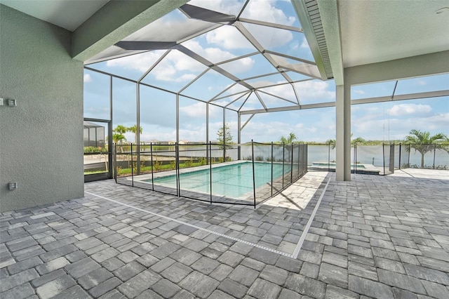 view of pool with a lanai and a patio