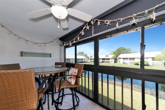 sunroom featuring ceiling fan